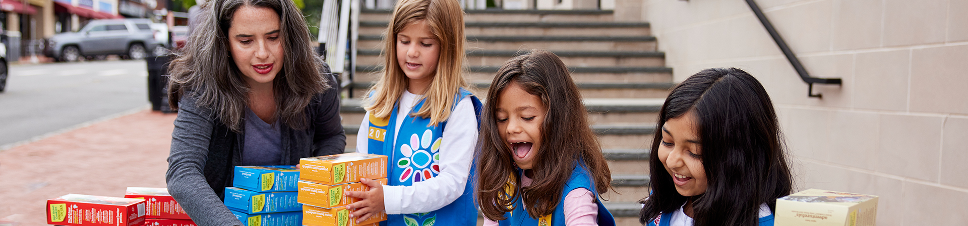  Girl Scouts selling cookies 