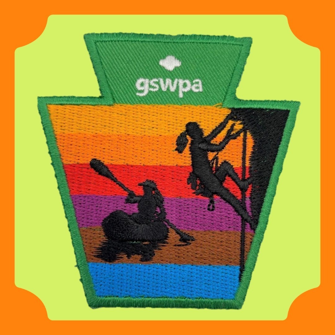 multi-color keystone shaped patch with gswpa logo and shadows of a girl canoeing and a girl rock climbing