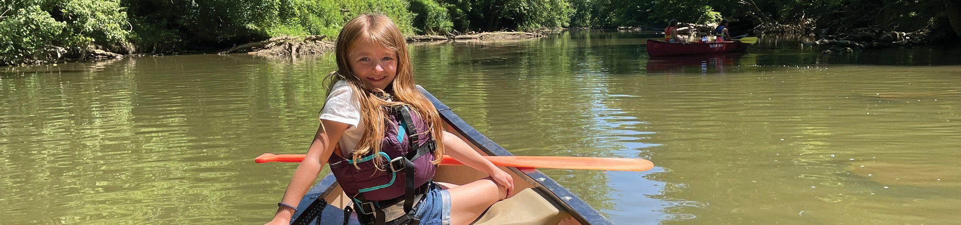  Girl in a canoe looking back 