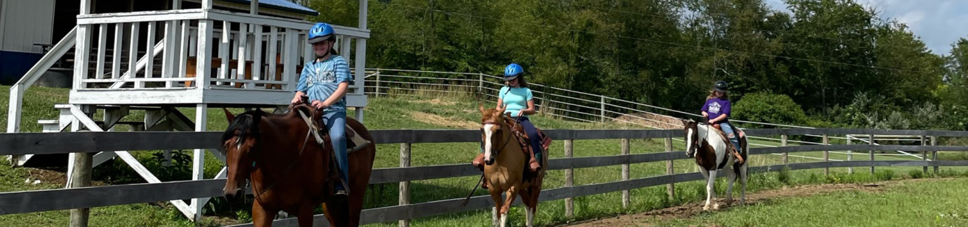  Three girls riding horses 