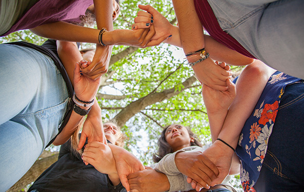 group of girls holding hands